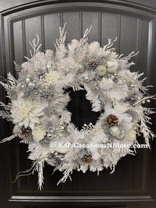 White Evergreen Winter Wreath with White Poinsettias, Frosted Pine Cones, Christmas Balls of Silver, White and Gray, along with Silver Glittered Fern and Snow Covered Twigs and 2 White Doves on a Black Door