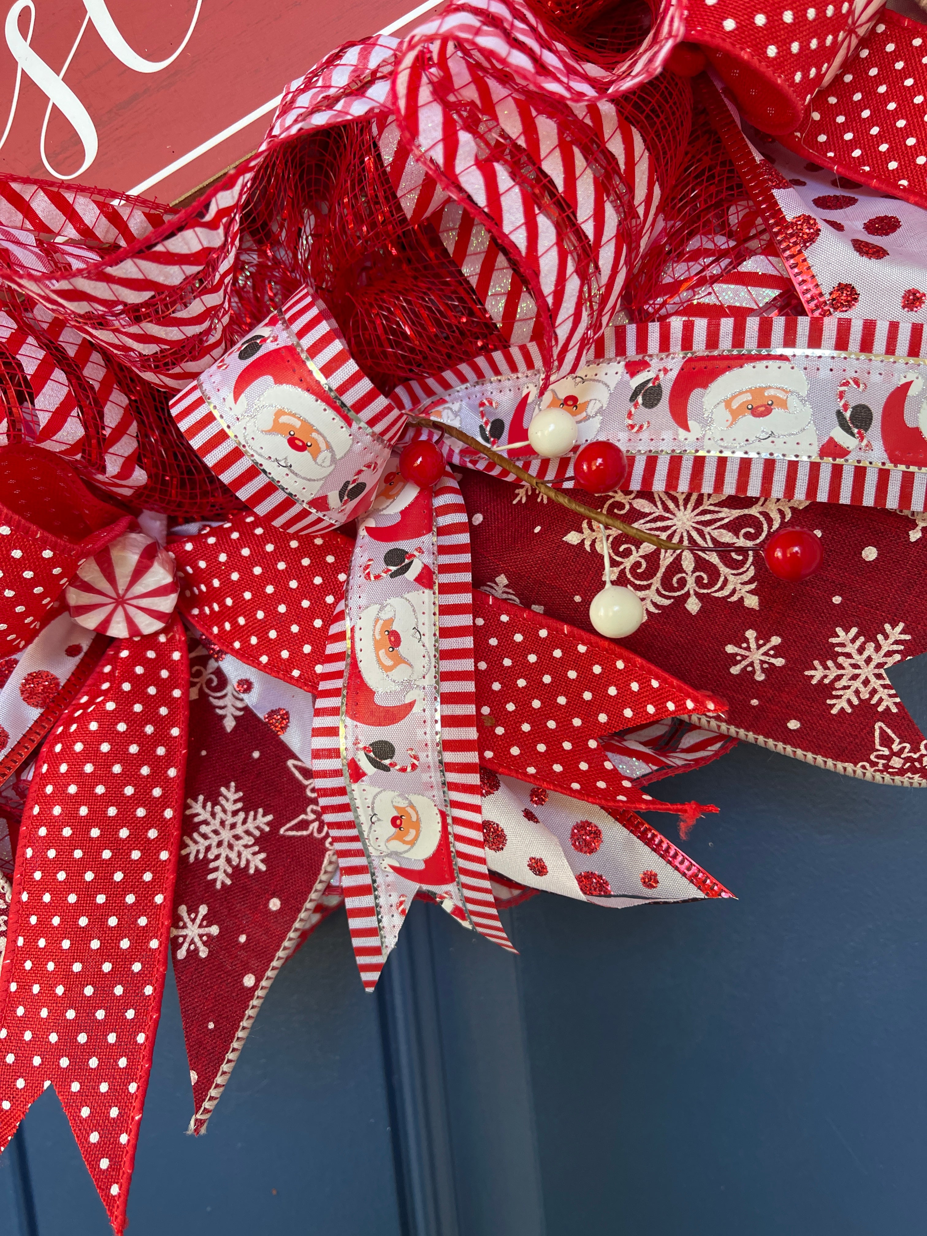 Close Up Detail of Santa Face Ribbon, Red with White Polka Dot Ribbon, Snowflakes on Red and red and White Berries
