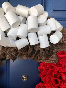 Close up of White Foam Marshmallows, Red and Brown Burlap on Cocoa Wreath 