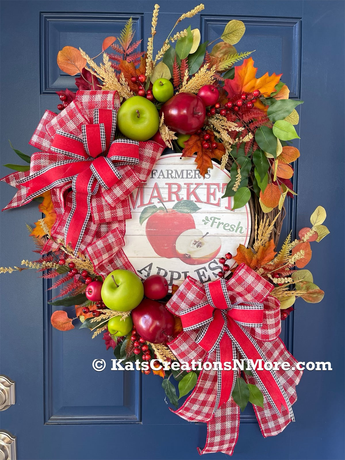 Fall Apple Grapevine Wreath filled with Red and Green Apples, Fall Leaves and Berries, Double Bows of Red, White and Black with a Farmers Market Fresh Apples Sign in the Center. 