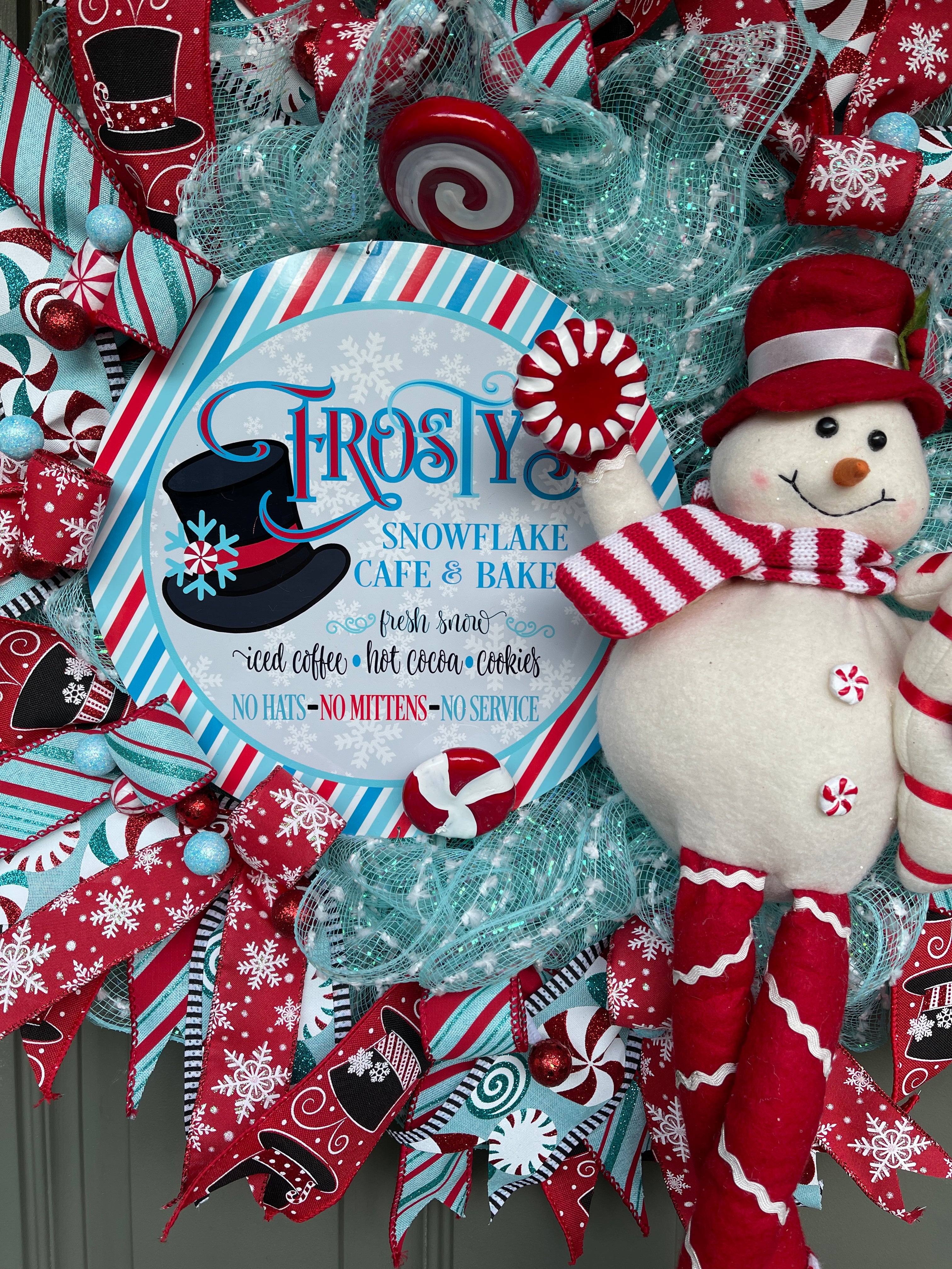Red, White and Blue Winter Frosty the Snowman Deco Mesh Wreath with Peppermint Candy and Plush Snowman on a Green Door.