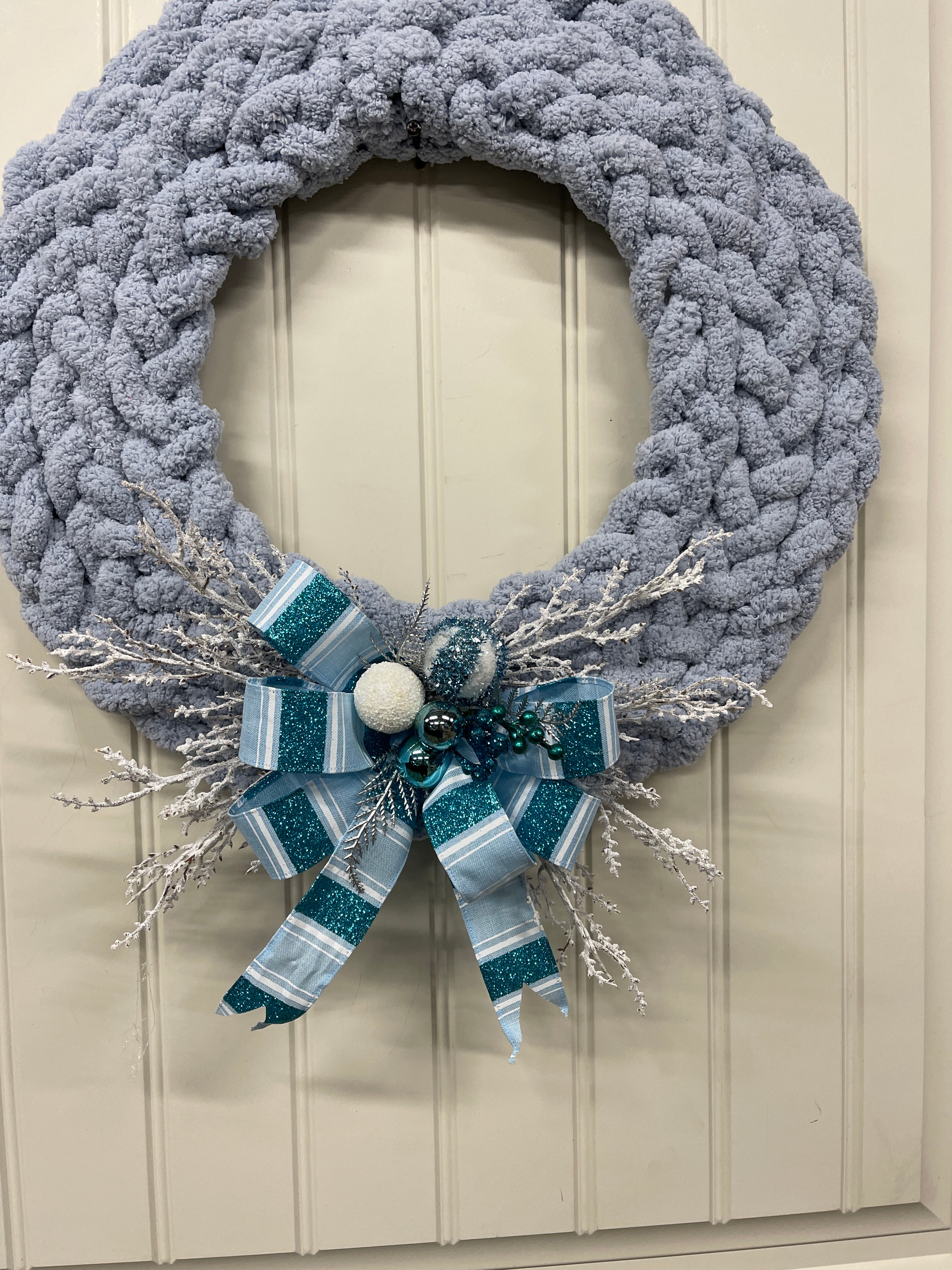 Blue Gray Chenille Yarn Braided Winter Wreath on a White Door