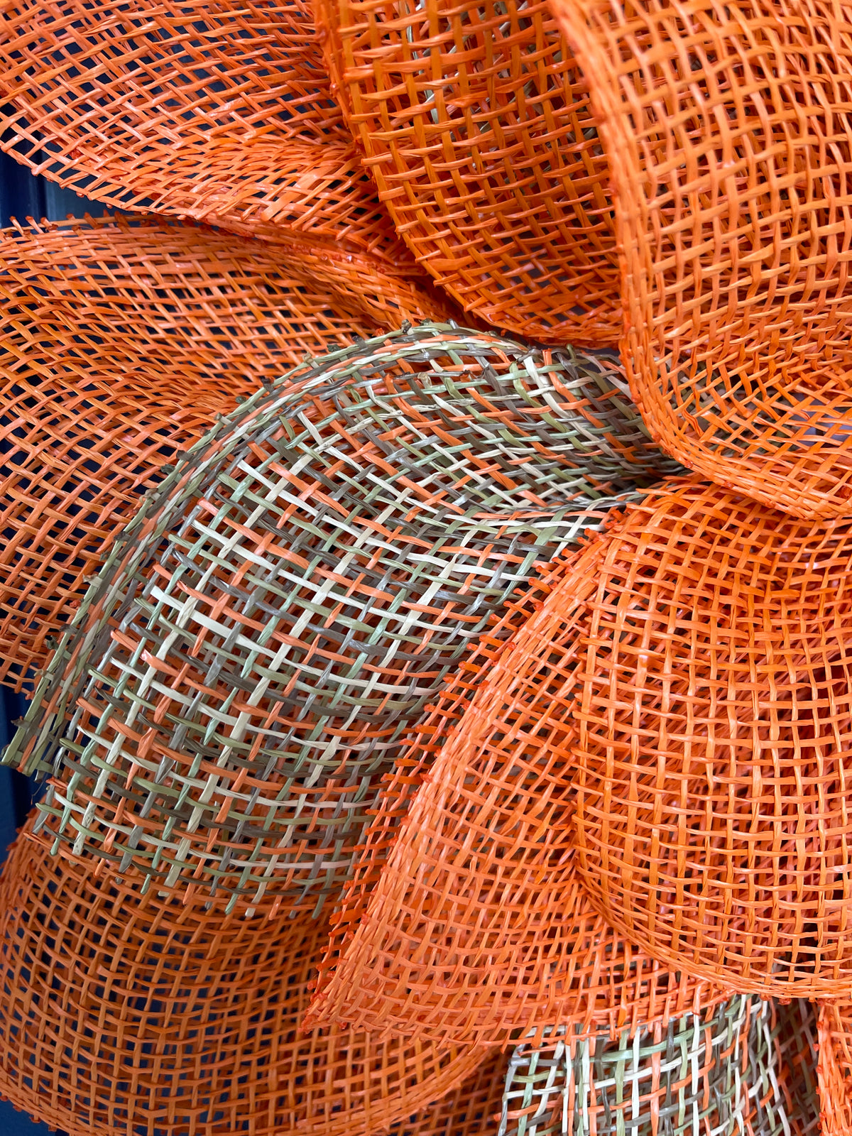Close up of the Petals of Poly Burlap, Orange and then Orange, Brown, Green and Tan Patterned Mesh