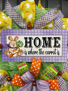 Close Up of Home is Where the Carrot Is Sign with Rabbit Holding a Carrot on a Wreath
