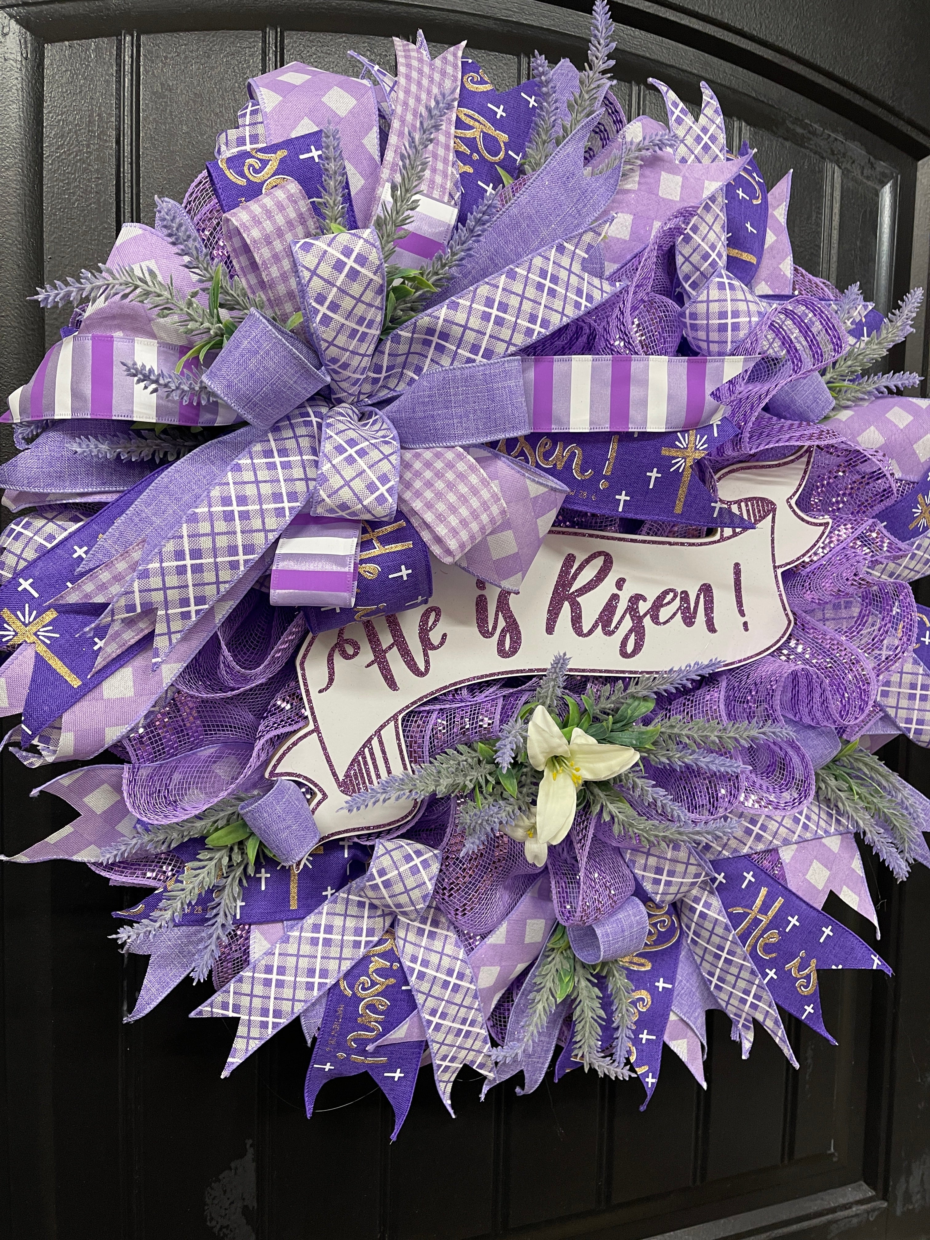Left Side View of Purple and White Deco Mesh Religious Easter He Is Risen Floral Wreath on Black Door