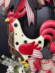 Close Up of White Metal Rooster with Black Polka Dots and Red Tail and Wings on Grapevine Wreath
