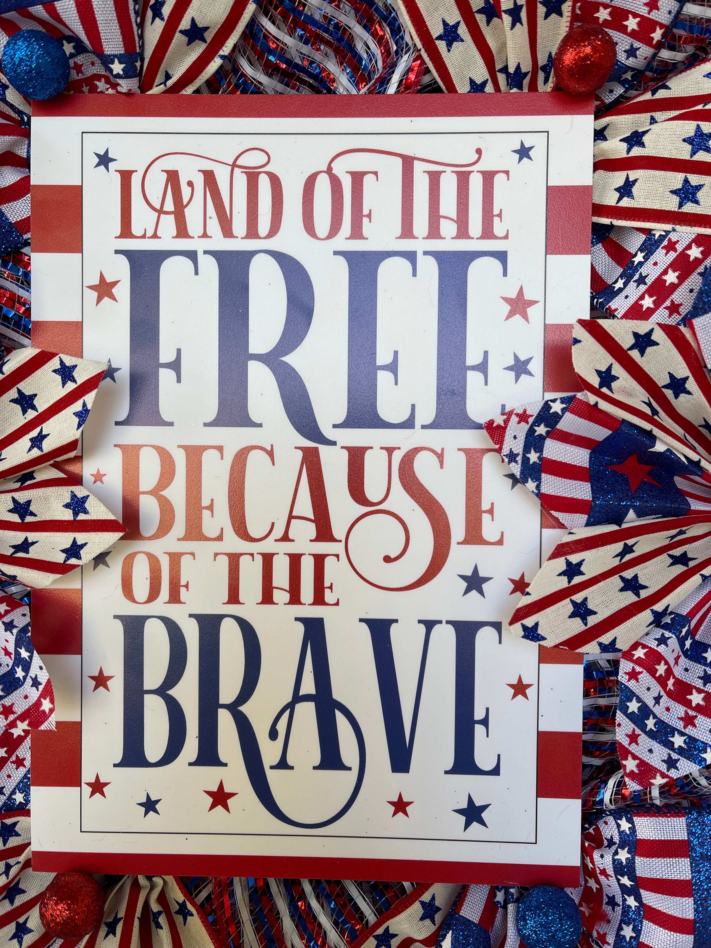 Land of the Free Because of the Brave Red and White Striped Sign with Red and Blue Stars