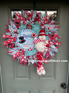 Red, White and Blue Winter Frosty the Snowman Deco Mesh Wreath with Peppermint Candy and Plush Snowman on a Green Door.