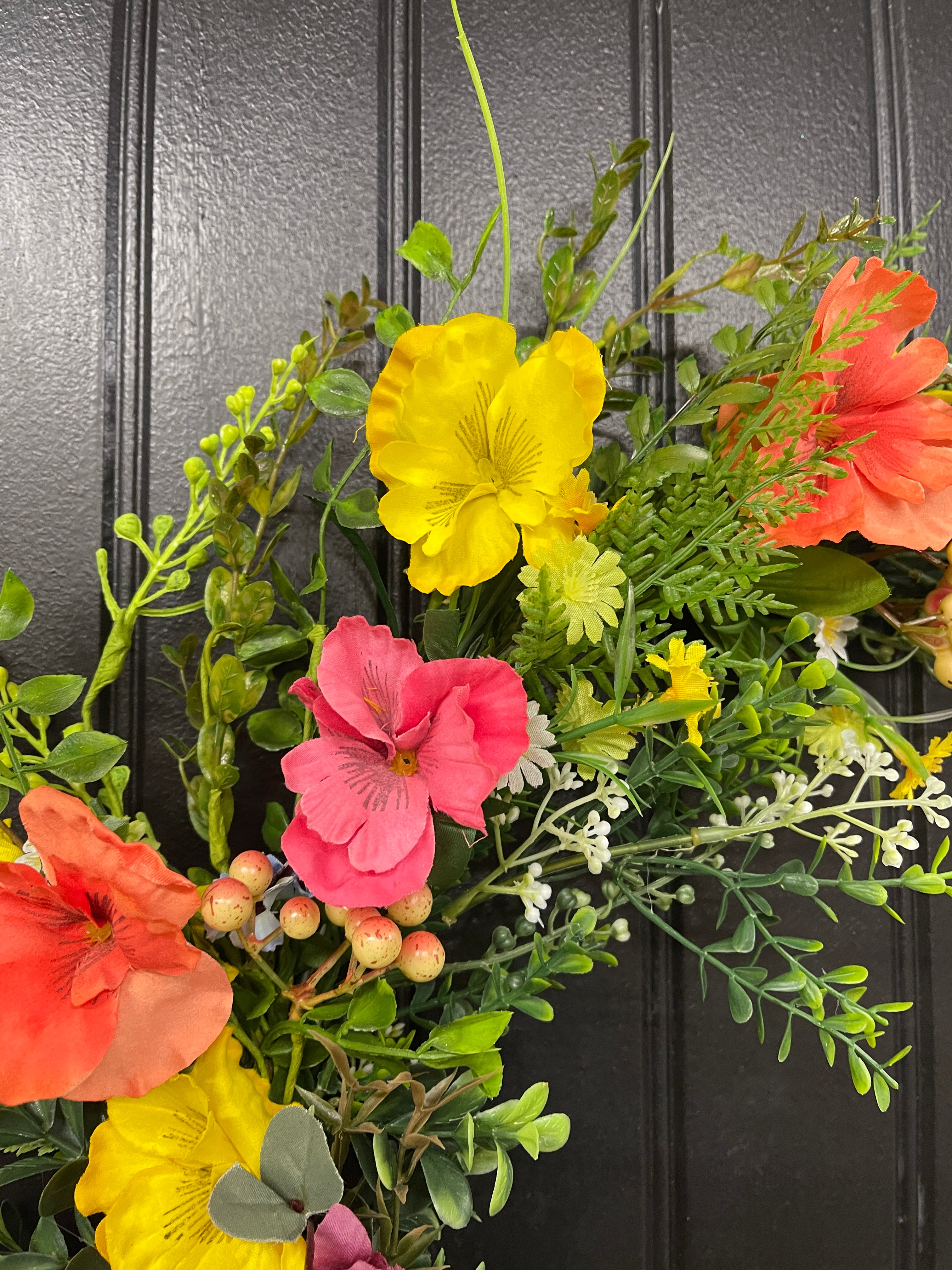 Orange, Pink and Yellow Cosmos Florals with Meadow Greens on a Silver Hoop Wreath on a Black Door