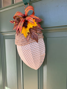 Right Side View of Fall Beige and Cream Basketweave Fabric Covered Acorn Shaped Wreath with Bow and Artificial Fall Leaves, Pinecones and Berries