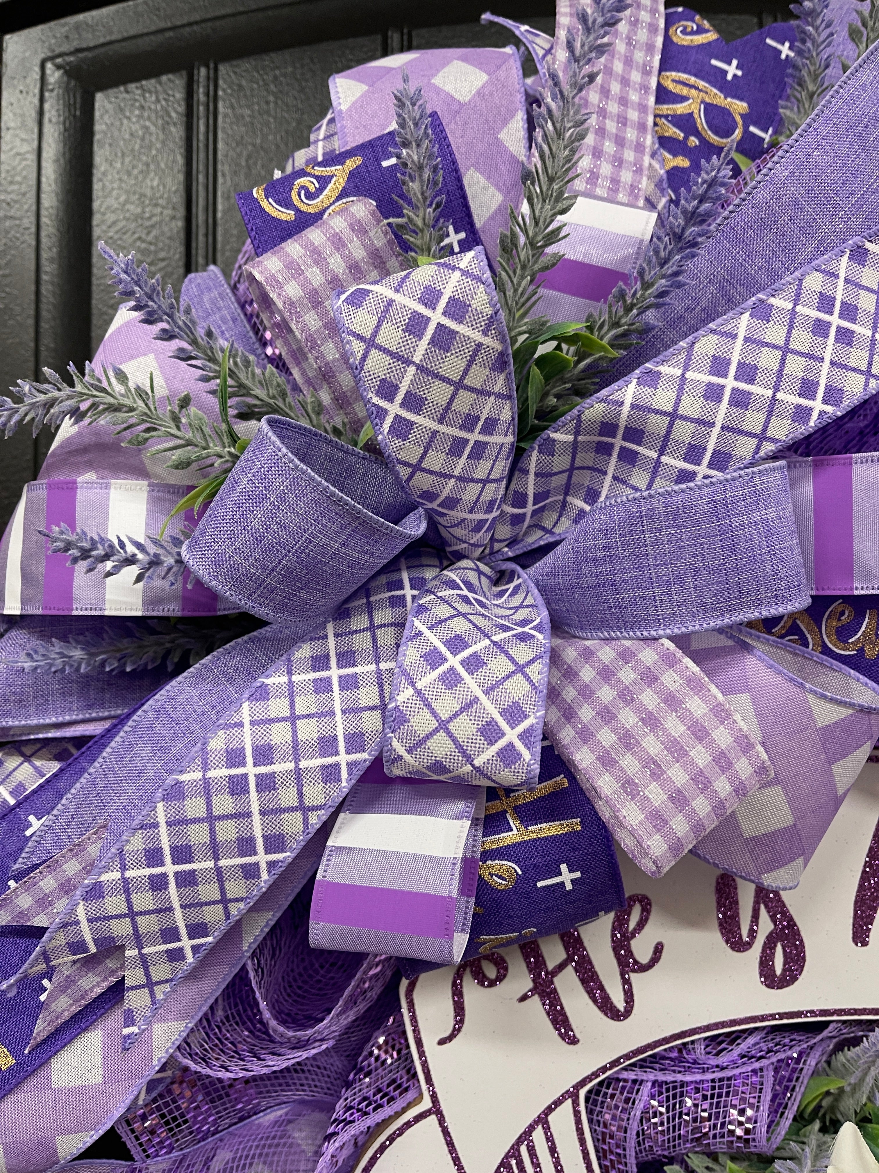Close Up of Bow featuring Lavender and Dark Purple Ribbons, along with White and Purple Plaid and Gingham Ribbon with sprigs of artificial lavender florals