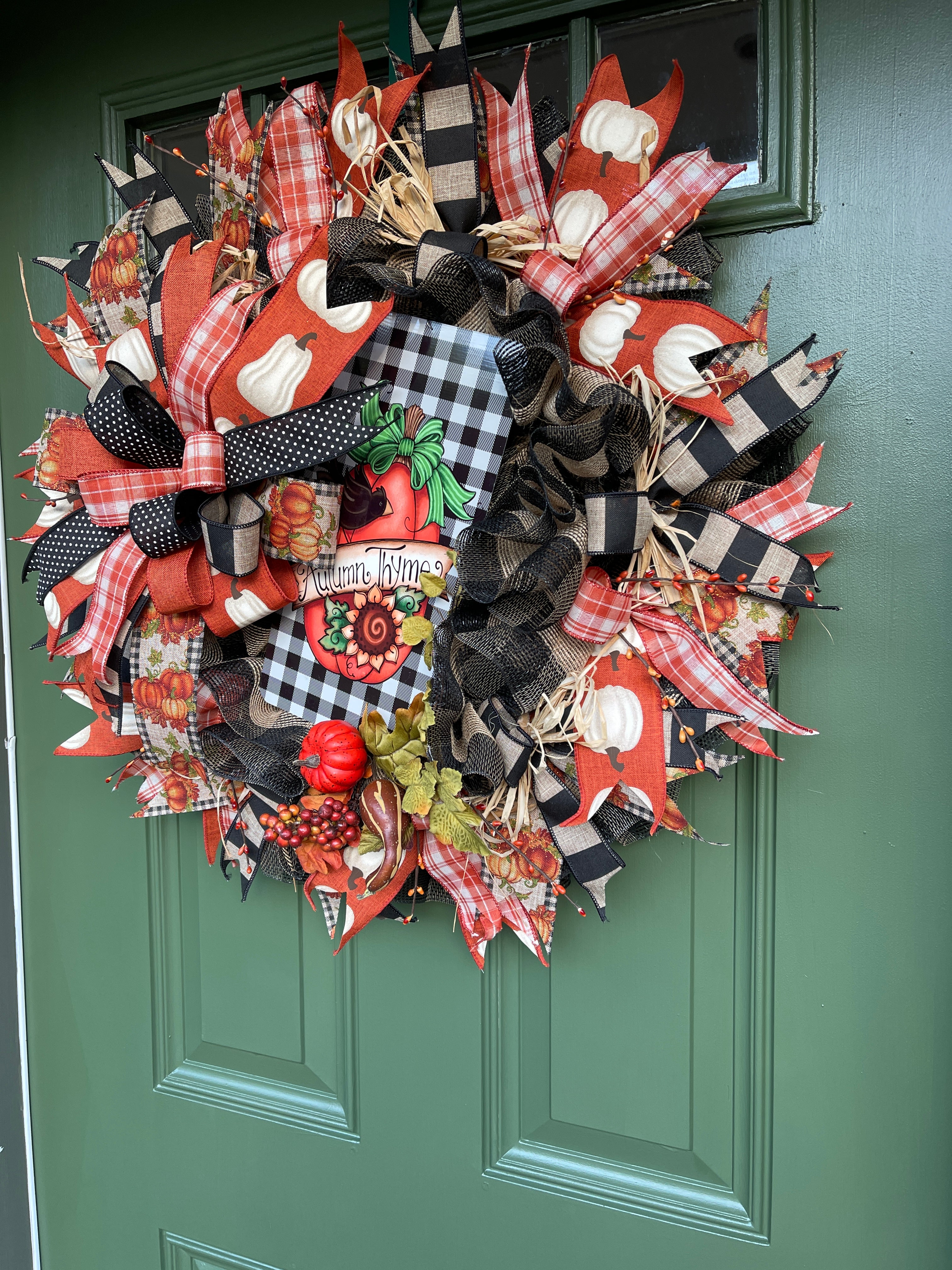 Right Side View of Black, White, Orange and Tan Deco Mesh Autumn Thyme Fall Wreath with Pumpkins on Green Door
