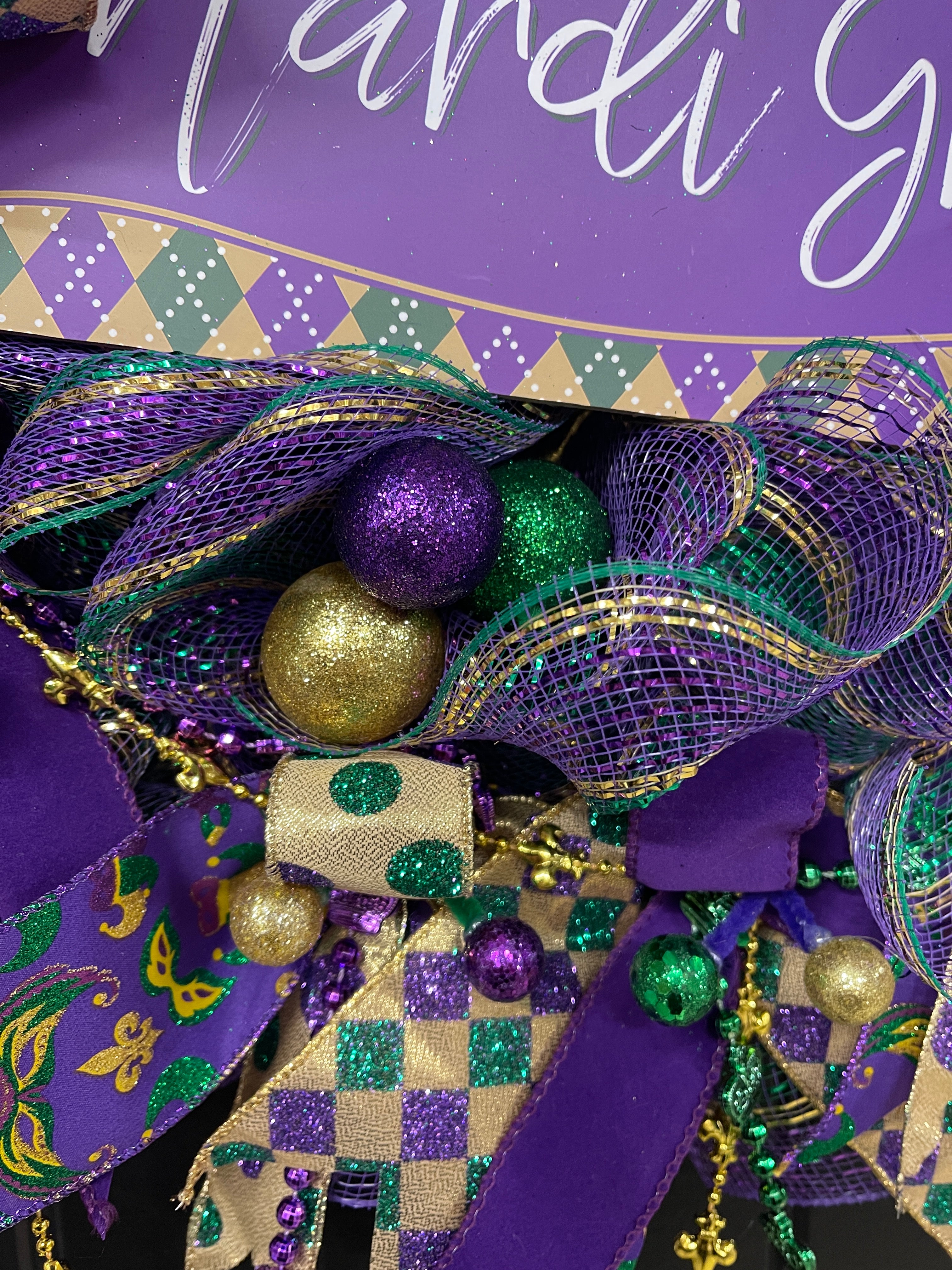 Close Up Detail of Green, Purple and Gold Glitter Balls