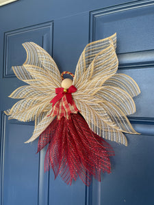 Right View of Rustic Farmhouse Jute Burlap and Red Metallic Angel Tree Topper with Red and Tan Plaid Apron, Red Bow, Gold Bell and Wooden Head on a Blue Door