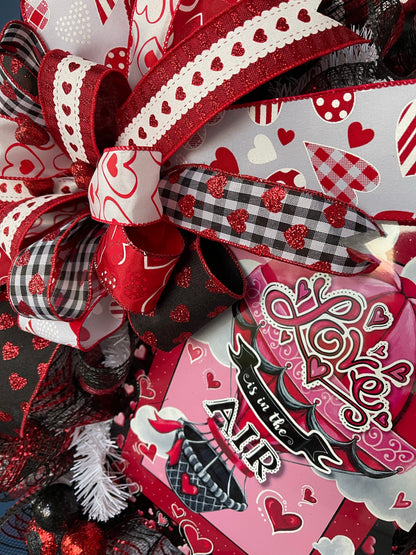 Red, White and Black Heart Filled Wreath with a Love its in the Air Hot Air Balloon sign  with a Bow on a Blue Door
