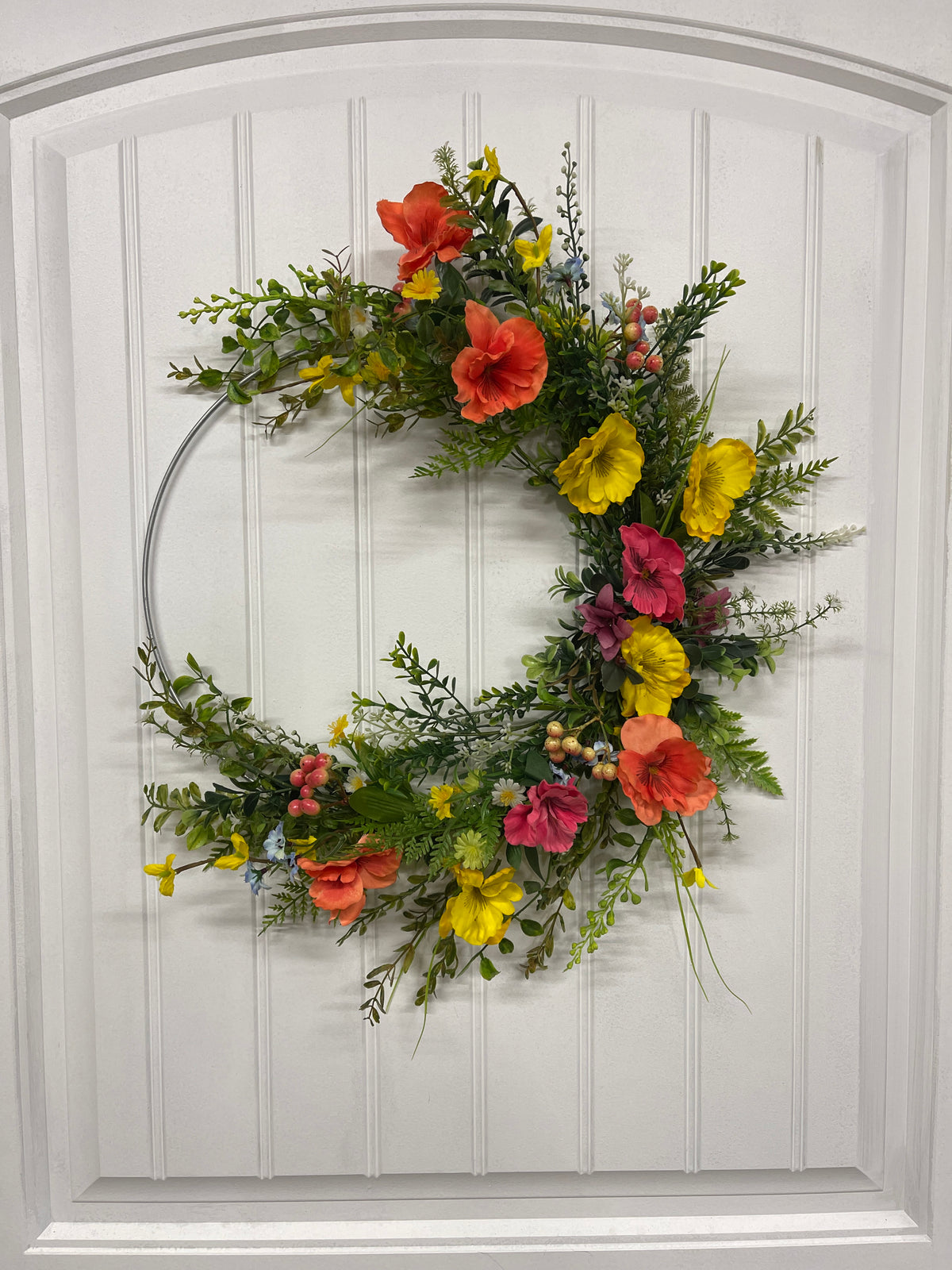 Orange, Pink and Yellow Cosmos Florals with Meadow Greens on a Silver Hoop Wreath on a White Door
