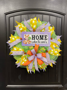Home is Where the Carrot Is Easter Bunny Wreath with Yellow, Purple, Green, Orange and White Ribbons and Bow on a Black Door