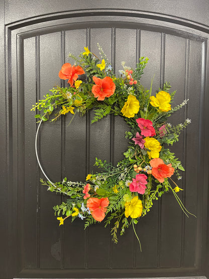 Orange, Pink and Yellow Cosmos Florals with Meadow Greens on a Silver Hoop Wreath on a Black Door